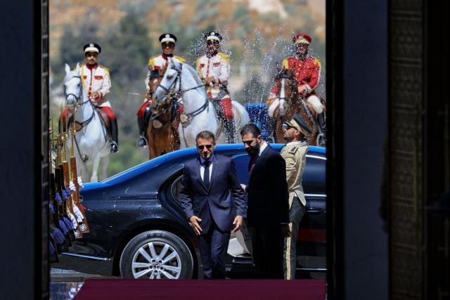 France's President Emmanuel Macron (L) and Syria's President Ahmed al-Sharaa arrive ahead of their meeting at the People's Palace in Damascus on July 7, 2026. Syria's President Ahmed al-Sharaa hailed France's "constructive role" in the transition since the toppling of longtime ruler Bashar al-Assad, as French leader Emmanuel Macron made the first post-conflict visit to Damascus by a Western European leader. (Photo by Ludovic MARIN / POOL / AFP)