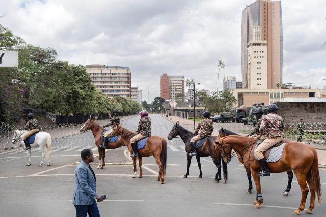 Mounted police reinforce a temporary barricade erected outside parliament buildings in anticipation of anti-government protests to commemorate the struggle against government oppression on annual day of protest known as Saba-saba in Nairobi on July 07, 2026. Kenyan police banned a march to mark an annual day of protest on Tuesday, using plainclothes officers and unmarked cars to drag away even the tiny group that managed to assemble.
The Kenyan government of President William Ruto has taken a zero-tolerance attitude to even the slightest hint of protest after massive and deadly demonstrations over the past two years. (Photo by Tony KARUMBA / AFP)