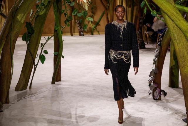 A model presents a creation for Chanel for the Women Haute Couture Fall/Winter 2026-2027 collection as part of the Paris Fashion Week, in Paris, on July 7, 2026. (Photo by GEOFFROY VAN DER HASSELT / AFP)