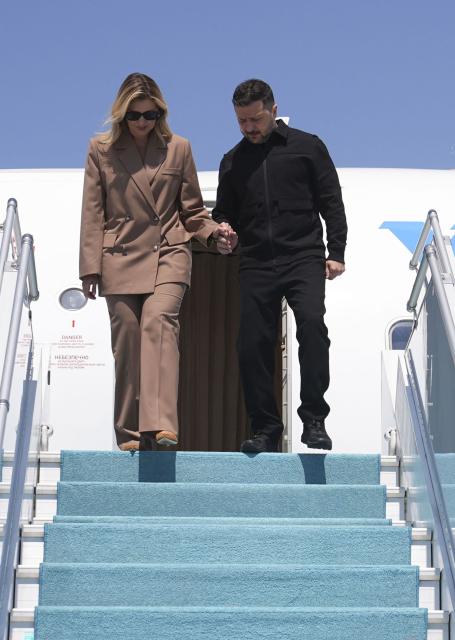 Ukraine's President Volodymyr Zelensky arrives with his wife Olena Zelenska (R) at Esenboga Airport to attend the 36th NATO Heads of State and Government Summit in Ankara on July 7, 2026. (Photo by Metin Akta? / POOL / AFP)