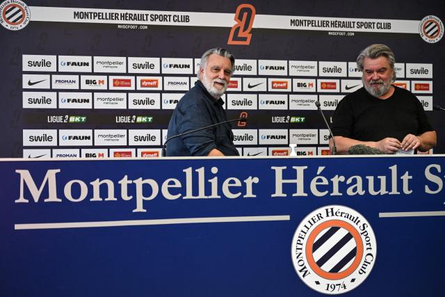 French Ligue 2 football club Montpellier Herault Sport Club's French President Laurent Nicollin (L) and his brother Olivier Nicollin, CEO of the Nicollin Group a company specialised in waste collection, urban and industrial cleaning, attend a press conference in Montpellier on july 7, 2026. (Photo by Gabriel BOUYS / AFP)