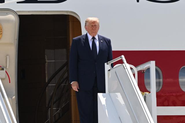 US President Donald Trump disembarks from Air Force One upon his arrival at Etimesgut Air Base near Ankara, on July 7, 2026, to attend the 36th NATO Heads of State and Government Summit. (Photo by Abdullah Güçlü / POOL / AFP)
