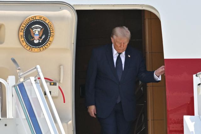 US President Donald Trump disembarks from Air Force One upon his arrival at Etimesgut Air Base near Ankara, on July 7, 2026, to attend the 36th NATO Heads of State and Government Summit. (Photo by Abdullah Güçlü / POOL / AFP)