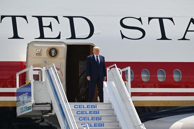 US President Donald Trump disembarks from Air Force One upon his arrival at Etimesgut Air Base near Ankara, on July 7, 2026, to attend the 36th NATO Heads of State and Government Summit. (Photo by Abdullah Güçlü / POOL / AFP)