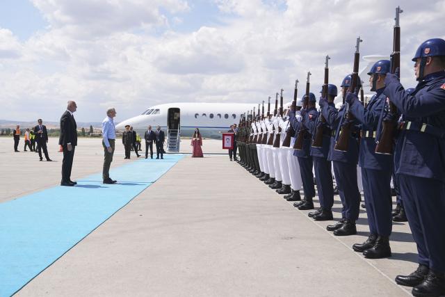 Norway's Prime Minister Jonas Gahr is welcomed by Turkey's Minister of Culture and Tourism Mehmet Nuri Ersoy (L) at Esenboga Airport upon his arrival to attend the 36th NATO Heads of State and Government Summit in Ankaraon July 7, 2026. (Photo by Metin Akta? / POOL / AFP)