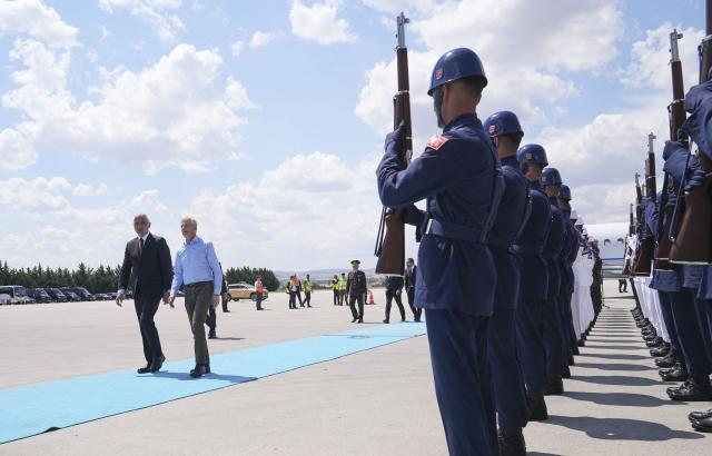 Norway's Prime Minister Jonas Gahr is welcomed by Turkey's Minister of Culture and Tourism Mehmet Nuri Ersoy (L) at Esenboga Airport upon his arrival to attend the 36th NATO Heads of State and Government Summit in Ankaraon July 7, 2026. (Photo by Metin Akta? / POOL / AFP)