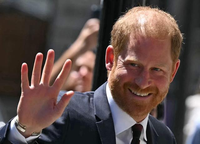 Britain's Prince Harry, Duke of Sussex, waves as he arrives at Chatham House in central London on July 7, 2026, to attend the fourteenth Invictus Games Foundation Conversation: From Policy to Practice, as part of the One Year to Go celebrations for the Invictus Games Birmingham 2027. (Photo by JUSTIN TALLIS / AFP)