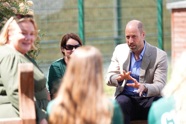 Britain's Prince William, Prince of Wales gestures during a visit to the Ysgol Gymraeg Llundain (The London Welsh School) in Hanwell, West London on July 7, 2026 as he joins pupils in sending their best wishes to Team Wales ahead of the Glasgow 2026 Commonwealth Games. (Photo by Aaron Chown / POOL / AFP)