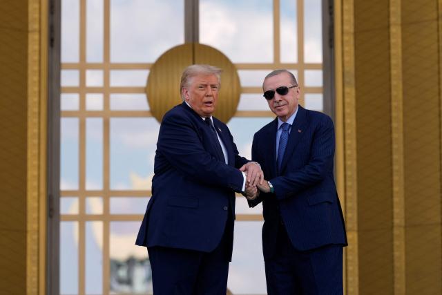Turkish President Recep Tayyip Erdogan (R) shakes hands with US President Donald Trump during a state arrival ceremony at Bestepe Presidential Compound in Ankara, on July 7, 2026, on the sidelines of the NATO Summit. (Photo by Emrah Gurel / POOL / AFP)