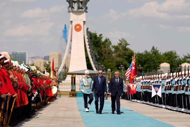 Turkish President Recep Tayyip Erdogan (L) walks with US President Donald Trump (R) during a state arrival ceremony at Bestepe Presidential Compound in Ankara, on July 7, 2026, on the sidelines of the NATO Summit. (Photo by Emrah Gurel / POOL / AFP)