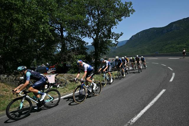 The chasing group rides during the 4th stage of the 113th edition of the Tour de France cycling race, 181,9 km between Carcassonne and Foix in southwestern France, on July 7, 2026. (Photo by Loic VENANCE / AFP)