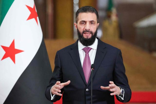 Syrian President Ahmed al-Sharaa speaks during a joint press conference with France's President in Damascus on July 7, 2026. French President Emmanuel Macron arrived in Damascus on July 6, 2026 for the first visit by a Western European head of state since Syria's new authorities took power in 2024, an AFP journalist said. Macron, who will depart on July 7, 2026, will advocate for "a free, pluralist Syria that respects each of its components" and plays a role in moderating Middle East tensions, the French presidency told journalists ahead of his arrival. (Photo by Ludovic MARIN / POOL / AFP)