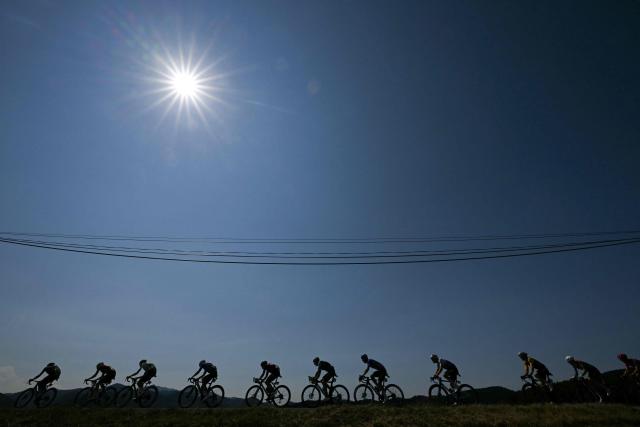 TOPSHOT - The chasing group cycles during the 4th stage of the 113th edition of the Tour de France cycling race, 181,9 km between Carcassonne and Foix in southwestern France, on July 7, 2026. (Photo by Loic VENANCE / AFP)