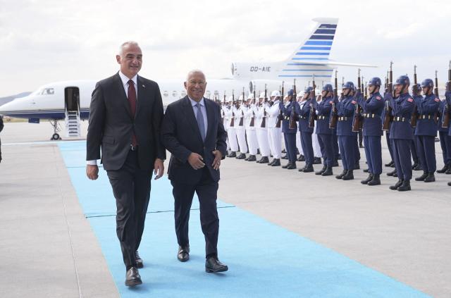 European Council President Antonio Costa (R) is welcomed by Turkish Culture and Tourism Minister Mehmet Nuri Ersoy (L) upon arrival at Esenboga Airport to attend the 36th NATO Heads of State and Government Summit in Ankara on July 7, 2026. (Photo by Metin Akta? / POOL / AFP)