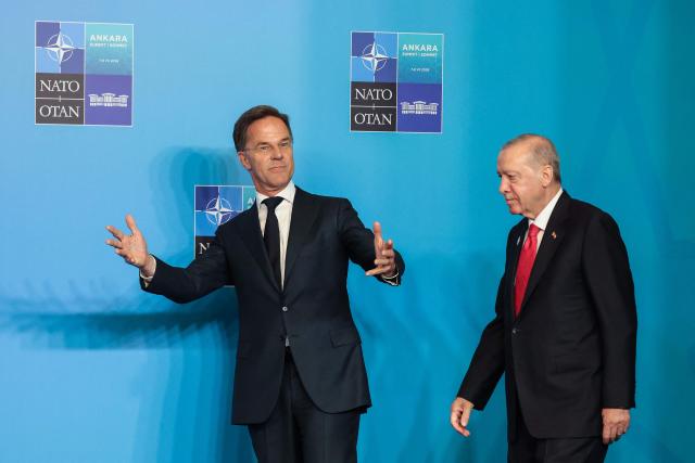 NATO Secretary General Mark Rutte and Turkey's President Recep Tayyip Erdogan (R) arrive for a NATO Summit at Bestepe Presidential Compound in Ankara, Turkey, July 8, 2026. The summit comes at a fraught time for the 77-year-old transatlantic alliance, with the US President demanding members make good on a pledge to ramp up defence spending as Washington takes a step back from Europe. (Photo by Ludovic MARIN / POOL / AFP)