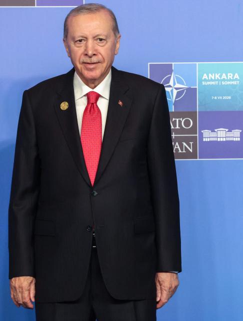 Turkey's President Recep Tayyip Erdogan reacts as he greets guests for the NATO summit in Ankara, on July 8, 2026. The summit comes at a fraught time for the 77-year-old transatlantic alliance, with the US President demanding members make good on a pledge to ramp up defence spending as Washington takes a step back from Europe. (Photo by Ludovic MARIN / POOL / AFP)