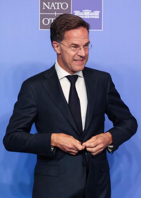 NATO Secretary General Mark Rutte reacts as he greets guests for the NATO summit in Ankara, on July 8, 2026. The summit comes at a fraught time for the 77-year-old transatlantic alliance, with the US President demanding members make good on a pledge to ramp up defence spending as Washington takes a step back from Europe. (Photo by Ludovic MARIN / POOL / AFP)