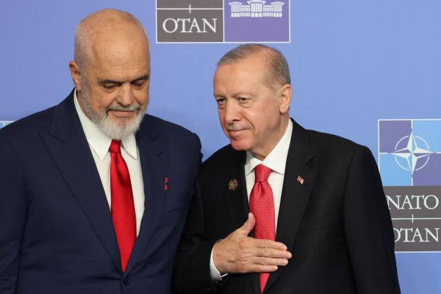 Turkey's President Recep Tayyip Erdogan greets Albania's Prime Minister Edi Rama (L) as he arrives for a NATO Summit at Bestepe Presidential Compound in Ankara, Turkey, July 8, 2026. The summit comes at a fraught time for the 77-year-old transatlantic alliance, with the US President demanding members make good on a pledge to ramp up defence spending as Washington takes a step back from Europe. (Photo by Ludovic MARIN / POOL / AFP)