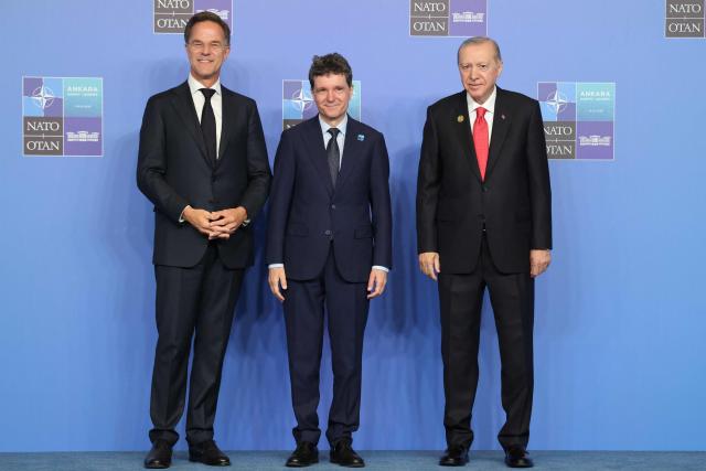 NATO Secretary General Mark Rutte (L) and Turkey's President Recep Tayyip Erdogan greet Romania's President Nicusor Dan as he arrives for a NATO Summit at Bestepe Presidential Compound in Ankara, Turkey, July 8, 2026. The summit comes at a fraught time for the 77-year-old transatlantic alliance, with the US President demanding members make good on a pledge to ramp up defence spending as Washington takes a step back from Europe. (Photo by Ludovic MARIN / POOL / AFP)