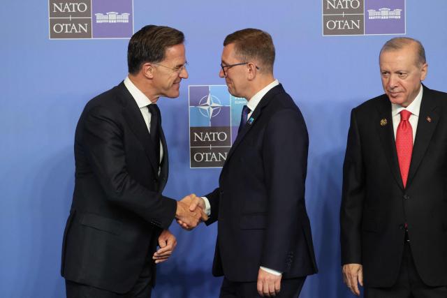 NATO Secretary General Mark Rutte (L) and Turkey's President Recep Tayyip Erdogan greet Estonia's Prime Minister Kristen Michal (C) as he arrives for a NATO Summit at Bestepe Presidential Compound in Ankara, Turkey, July 8, 2026. The summit comes at a fraught time for the 77-year-old transatlantic alliance, with the US President demanding members make good on a pledge to ramp up defence spending as Washington takes a step back from Europe. (Photo by Ludovic MARIN / POOL / AFP)