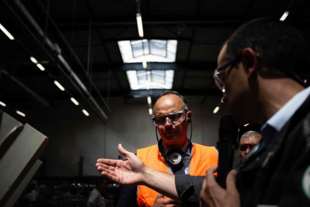 Founder and President of French right-wing party Horizons, Mayor of Le Havre and candidate for the 2027 French presidential election Edouard Philippe (L) visits the French manufacturer of welding supplies factory, Selectarc, in Grandvillars, eastern France on July 8, 2026, as part of his Presidential campaign. France votes in a presidential election scheduled for April 2027. (Photo by SEBASTIEN BOZON / AFP)