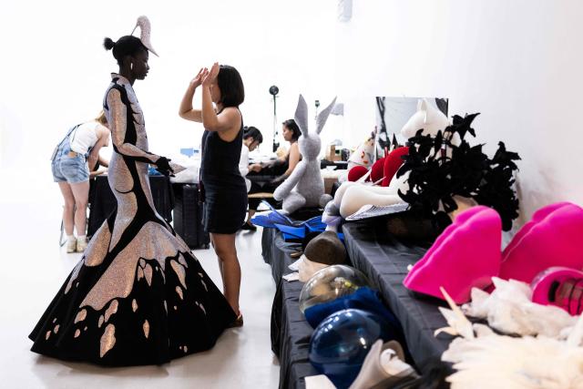 A model wears a dress made by Hong-Kong born and London based Fashion designer Robert Wun, in its atelier in Paris on July 7, 2026 during a fitting session on the eve of the Robert Wun Women Haute Couture Fall/Winter 2026-2027 collection as part of the Paris Fashion Week. Hong Kong-born designer Robert Wun has not had a holiday in years, but he's not complaining. In 2021, he was working from his kitchen -- now he dresses some of the world's best-known entertainers. In just five years, the 34-year-old has rocketed from unknown to one of the most sought-after names in the fashion world, designing for everyone from Lady Gaga, Beyonce to rapper Cardi B. (Photo by JOEL SAGET / AFP)