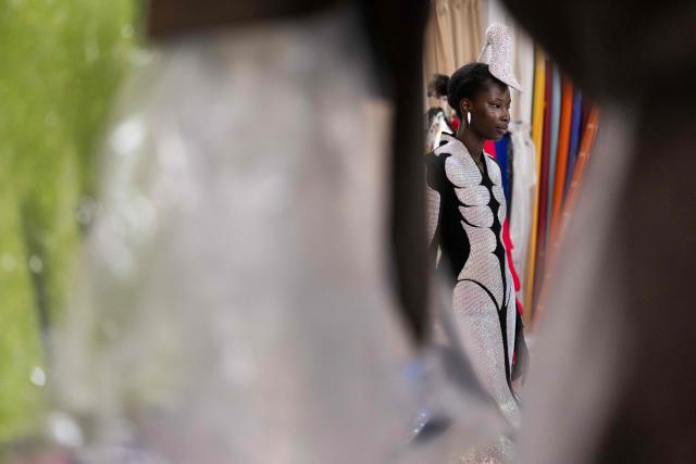 A model wears a dress made by Hong-Kong born and London based Fashion designer Robert Wun, in its atelier in Paris on July 7, 2026 during a fitting session on the eve of the Robert Wun Women Haute Couture Fall/Winter 2026-2027 collection as part of the Paris Fashion Week. Hong Kong-born designer Robert Wun has not had a holiday in years, but he's not complaining. In 2021, he was working from his kitchen -- now he dresses some of the world's best-known entertainers. In just five years, the 34-year-old has rocketed from unknown to one of the most sought-after names in the fashion world, designing for everyone from Lady Gaga, Beyonce to rapper Cardi B. (Photo by JOEL SAGET / AFP)