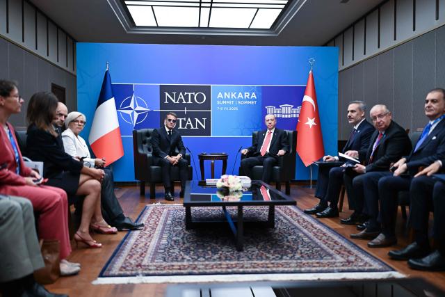 French President Emmanuel Macron (L) meets with Turkish President Recep Tayyip Erdogan in a bilateral meeting on the sidelines of the 36th NATO Summit at Bestepe Presidential Compound in Ankara, Turkey, July 8, 2026. (Photo by Alexis JUMEAU / POOL / AFP)