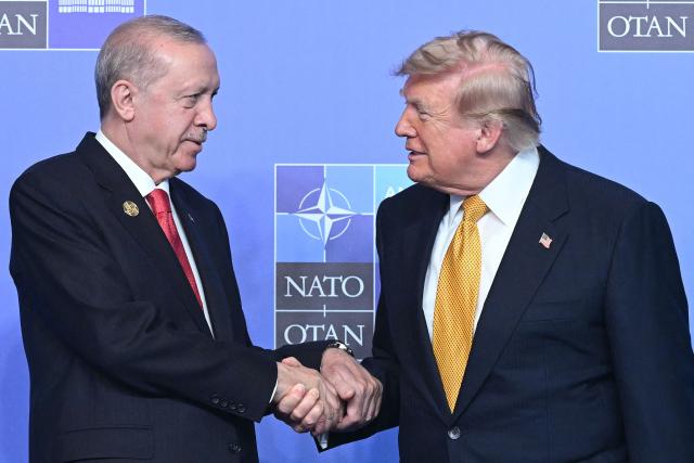 TOPSHOT - Turkey's President Recep Tayyip Erdogan (L) shakes hands with US President Donald Trump during the NATO Summit at Bestepe Presidential Compound in Ankara, Turkey, on July 8, 2026. The summit comes at a fraught time for the 77-year-old transatlantic alliance, with the US President demanding members make good on a pledge to ramp up defence spending as Washington takes a step back from Europe. (Photo by Saul LOEB / AFP)