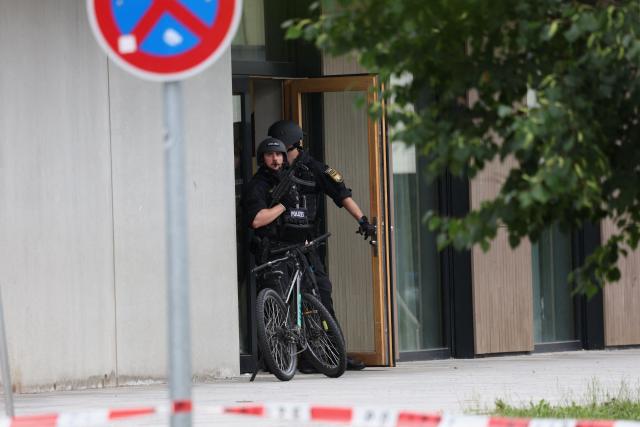 Support Command stand at an entrance of a secondary school Schongau, in the southern German state of Bavaria, where several people have been wounded and a suspect arrested in an attack on July 8, 2026. The perpetrator appeared to have deliberately targeted the school in a suspected "rampage", a police spokeswoman told AFP. (Photo by Karl-Josef Hildenbrand / dpa / AFP) / Germany OUT