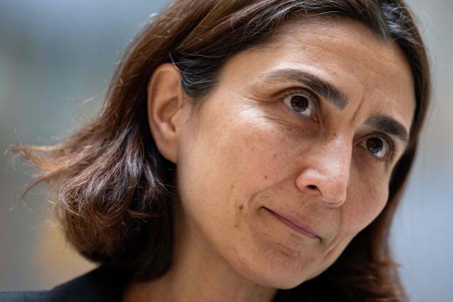 Deniz Igan, Division Chief in the International Monetary Fund (IMF)s Research Department speaks during an AFP interview at the IMF Headquarters in Washington, DC, on July 7, 2026. The IMF on July 8, 2026, cut its 2026 growth projection for the world economy again, saying an AI boom has not fully offset the fallout from war in the Middle East. Deniz Igan, division chief at the IMF's research department, told AFP that its forecasts are "broadly unchanged" cumulatively for the next two years and described the bounceback as "a V-shaped recovery." The delayed recovery from war on Iran, longer disruptions and higher prices is part of the reason the world economy will take a bigger hit this year, she added. (Photo by Kent Nishimura / AFP)