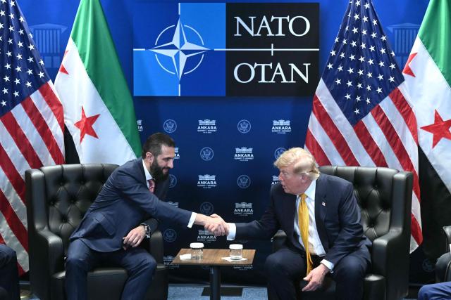 US President Donald Trump meets Syrian President Ahmed al-Sharaa (L) on the sidelines of the NATO Summit at Bestepe Presidential Compound in Ankara, on July 8, 2026. The summit comes at a fraught time for the 77-year-old transatlantic alliance, with the US President demanding members make good on a pledge to ramp up defence spending as Washington takes a step back from Europe. (Photo by SAUL LOEB / AFP)