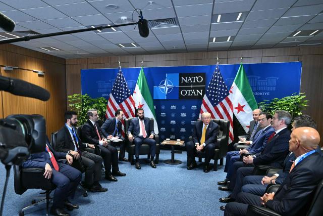 US President Donald Trump (C-R) meets Syrian President Ahmed al-Sharaa (C-L) on the sidelines of the NATO Summit at Bestepe Presidential Compound in Ankara, on July 8, 2026. The summit comes at a fraught time for the 77-year-old transatlantic alliance, with the US President demanding members make good on a pledge to ramp up defence spending as Washington takes a step back from Europe. (Photo by SAUL LOEB / AFP)