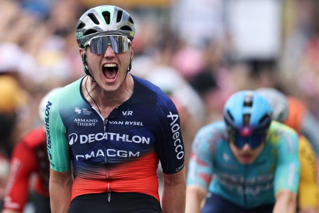 Decathlon CMA CGM Team's Dutch rider Olav Kooij cycles to the finish line to win the 5th stage ahead of XDS Astana Team's German rider Max Kanter (R) on the 113th edition of the Tour de France cycling race, 158 km between Lannemezan and Pau in southwestern France, on July 8, 2026. (Photo by Anne-Christine POUJOULAT / AFP)