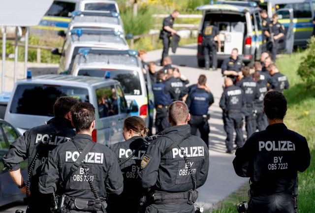 Police officers are pictured at a secondary school Schongau, in the southern German state of Bavaria, where  several people have been wounded and a suspect arrested in an attack on July 8, 2026. At least two girls have been seriously wounded and a 16-year-old suspect arrested after an attack at a secondary school in the southern German state of Bavaria on July 8, 2026.
The perpetrator appeared to have deliberately targeted the Welfen grammar school in the town of Schongau in a suspected "rampage", a police spokeswoman told AFP. (Photo by Michaela Stache / AFP) / ALTERNATIVE CROP