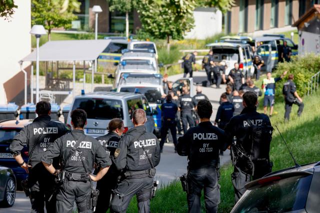 TOPSHOT - Police officers are pictured at a secondary school Schongau, in the southern German state of Bavaria, where  several people have been wounded and a suspect arrested in an attack on July 8, 2026. At least two girls have been seriously wounded and a 16-year-old suspect arrested after an attack at a secondary school in the southern German state of Bavaria on July 8, 2026.
The perpetrator appeared to have deliberately targeted the Welfen grammar school in the town of Schongau in a suspected "rampage", a police spokeswoman told AFP. (Photo by Michaela Stache / AFP)