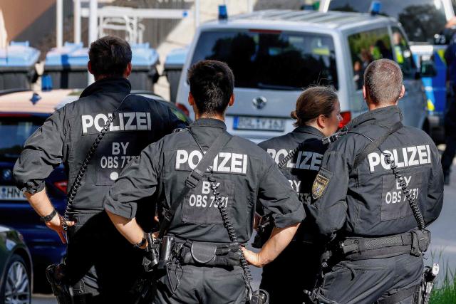 Police officers are pictured at a secondary school Schongau, in the southern German state of Bavaria, where  several people have been wounded and a suspect arrested in an attack on July 8, 2026. At least two girls have been seriously wounded and a 16-year-old suspect arrested after an attack at a secondary school in the southern German state of Bavaria on July 8, 2026.
The perpetrator appeared to have deliberately targeted the Welfen grammar school in the town of Schongau in a suspected "rampage", a police spokeswoman told AFP. (Photo by Michaela Stache / AFP) / ALTERNATIVE CROP