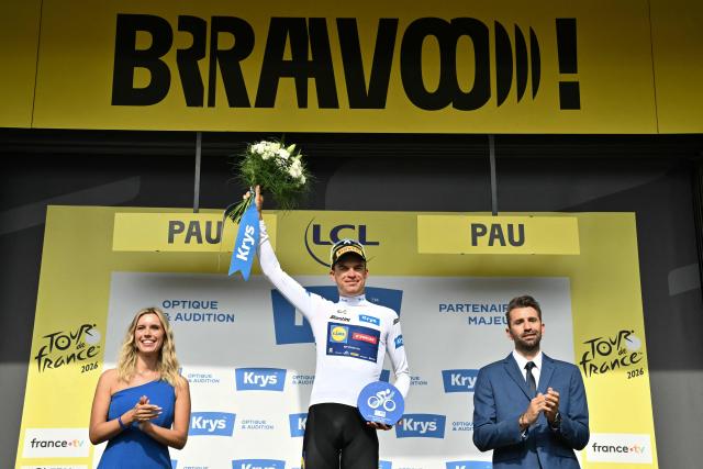 Lidl - Trek team's Czech rider Mathias Vacek celebrates on the podium with the best young rider's white jersey after the 5th stage of the 113th edition of the Tour de France cycling race, 158 km between Lannemezan and Pau in southwestern France, on July 8, 2026. (Photo by Jeff PACHOUD / AFP)