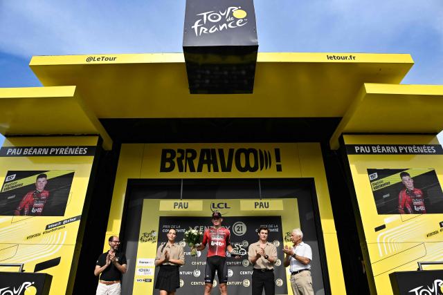 Lotto Intermarché team's French rider Baptiste Veistroffer celebrates on the podium with the most combative rider award after the 5th stage of the 113th edition of the Tour de France cycling race, 158 km between Lannemezan and Pau in southwestern France, on July 8, 2026. (Photo by Jeff PACHOUD / AFP)