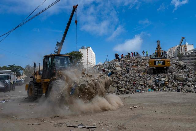 Heavy machinery is used on the ruins of a building destroyed by the June 24 earthquakes in Caraballeda, La Guaira state, Venezuela, on July 8, 2026. Venezuela's government called on July 8, 2026 for the release of frozen assets to help raise funds for the country's recovery from last month's twin earthquakes that killed at least 3,600 people. (Photo by Miguel MEDINA / AFP)