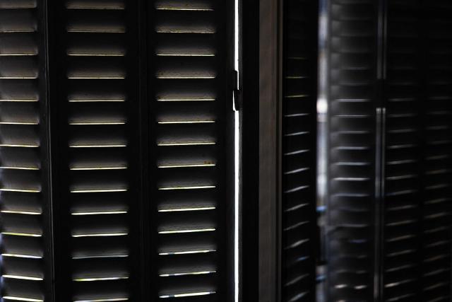 This photograph shows closed shutters in Paris, on July 8, 2026. (Photo by JOEL SAGET / AFP)