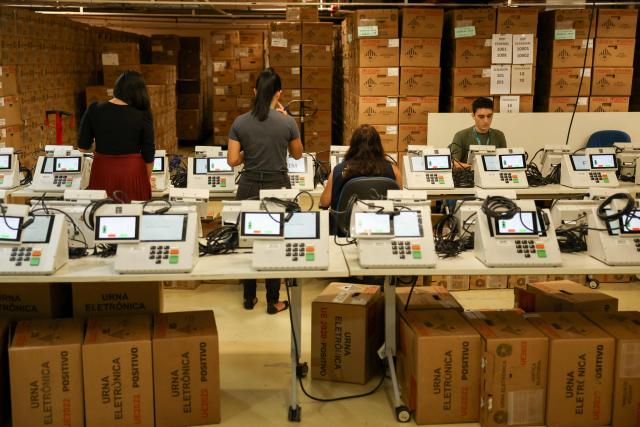Staff members of the Amazonas Regional Electoral Court (TRE/AM) test electronic voting machines in Manaus, Amazonas state, Brazil, on July 8, 2026. (Photo by MICHAEL DANTAS / AFP)