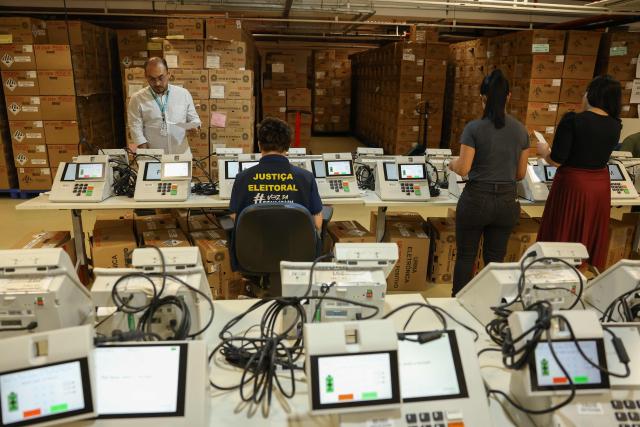 Staff members of the Amazonas Regional Electoral Court (TRE/AM) test electronic voting machines in Manaus, Amazonas state, Brazil, on July 8, 2026. (Photo by MICHAEL DANTAS / AFP)