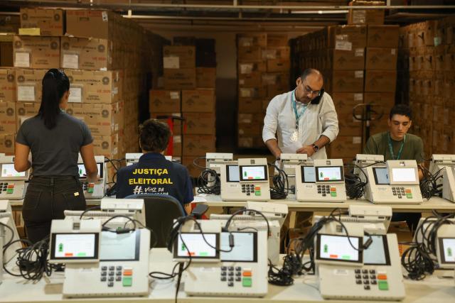 Staff members of the Amazonas Regional Electoral Court (TRE/AM) test electronic voting machines in Manaus, Amazonas state, Brazil, on July 8, 2026. (Photo by MICHAEL DANTAS / AFP)