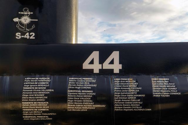 (FILES) A cenotaph bearing the names of the 44 members of the Argentine Navy who died during the sinking of the ARA San Juan submarine on November 15, 2017, is photographed in Rнo Gallegos, Santa Cruz province, Argentina on March 3, 2026, the day the trial of four former high-ranking Navy officers starts. An Argentine court has handed down a three-year suspended prison sentence to former naval commander Claudio Villamide in connection with the sinking of the submarine “ARA San Juan” in 2017, in which all 44 crew members lost their lives, according to the judgement read out by the court on July 8, 2026. (Photo by WALTER DIAZ / AFP)