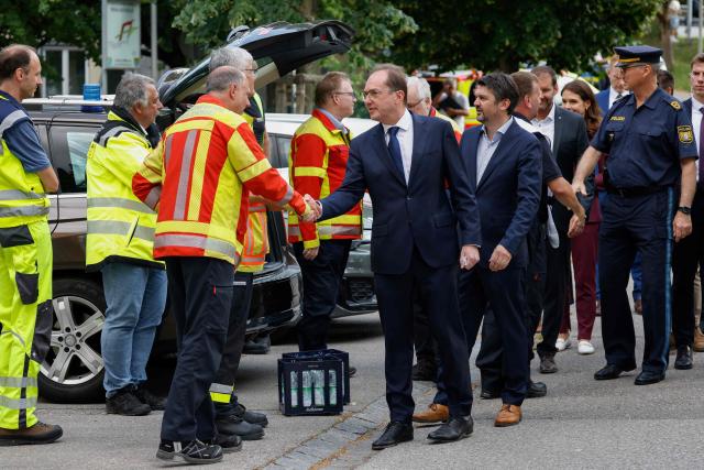 German Interior Minister Alexander Dobrindt (C) meets with first responders at a secondary school Schongau, in the southern German state of Bavaria, where  several people have been wounded and a suspect arrested in an attack on July 8, 2026. At least two girls have been seriously wounded and a 16-year-old suspect arrested after an attack at a secondary school in the southern German state of Bavaria on July 8, 2026.
The perpetrator appeared to have deliberately targeted the Welfen grammar school in the town of Schongau in a suspected "rampage", a police spokeswoman told AFP. (Photo by Michaela Stache / AFP)