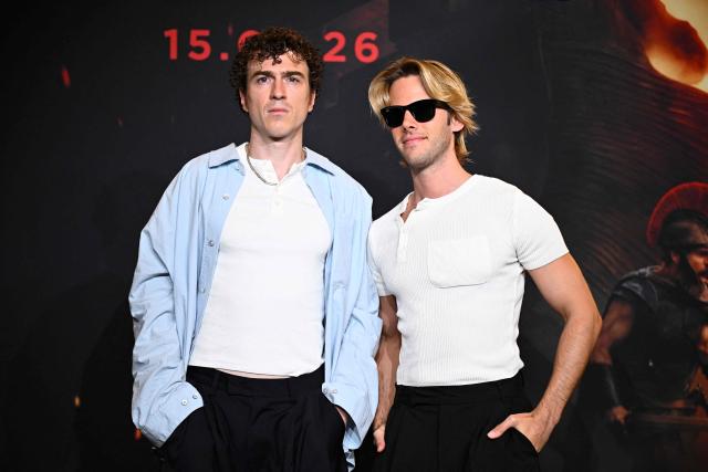 French DJ duo 'Ofenbach', Cesar de Rummel (L) and Dorian Lauduique (R), pose during a photocall ahead of the premiere of the film 'The Odyssey' at the Grand Rex Cinema in Paris on July 8, 2026. (Photo by JULIEN DE ROSA / AFP)