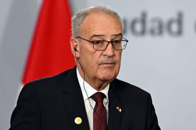 Switzerland's President of the Confederation and Economy Minister Guy Parmelin looks on during a joint press conference with Mexico's President Claudia Sheinbaum (out of frame) at the National Palace in Mexico City on July 8, 2026. (Photo by Yuri CORTEZ / AFP)