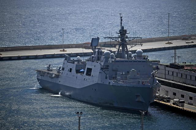 Aerial view of a US navy ship moored at the port of La Guaira, Venezuela, on July 8, 2026. Venezuela's government called on July 8, 2026 for the release of frozen assets to help raise funds for the country's recovery from last month's twin earthquakes that killed at least 3,600 people. (Photo by Federico PARRA / AFP)