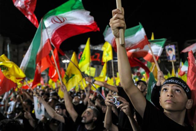 CORRECTION / Supporters of Lebanese Shia movement Hezbollah attend a memorial ceremony mourning Iran's slain supreme leader Ali Khamenei in Beirut’s southern suburbs on July 8, 2026. Iran began six days of public funeral ceremonies for Khamenei on July 4, including a dedicated day to neighbouring Iraq, a Shia powerhouse with close ties to Tehran. (Photo by Anwar AMRO / AFP) / “The erroneous mention[s] appearing in the metadata of this photo by Anwar AMRO has been modified in AFP systems in the following manner: [Correcting dateline and slug]. Please immediately remove the erroneous mention[s] from all your online services and delete it (them) from your servers. If you have been authorized by AFP to distribute it (them) to third parties, please ensure that the same actions are carried out by them. Failure to promptly comply with these instructions will entail liability on your part for any continued or post notification usage. Therefore we thank you very much for all your attention and prompt action. We are sorry for the inconvenience this notification may cause and remain at your disposal for any further information you may require.”